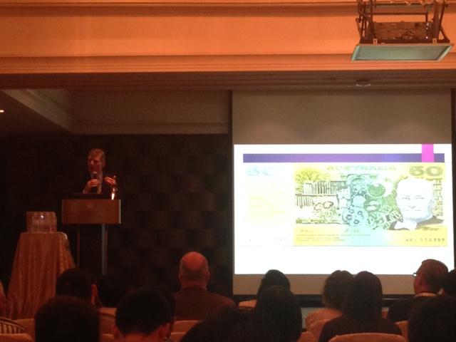 Prof David Patterson displaying a slide with the old Australian $50 bill, which displays a portrait of Howard Florey, who developed penicillin.