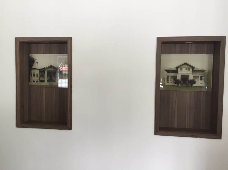 Stills of the old buildings, mounted inside the old bungalow.